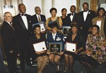 Bonnie Johnson and Wilmer Amina Carter receiving awards