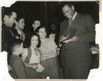 Paul Robeson signing autographs