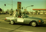 Car passing Thrifty gas station by Henry Hooks